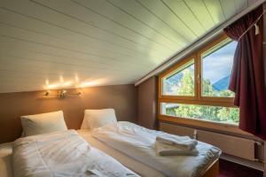 Postel nebo postele na pokoji v ubytování Duplex de charme à Zermatt