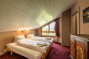 Postel nebo postele na pokoji v ubytování Duplex de charme à Zermatt