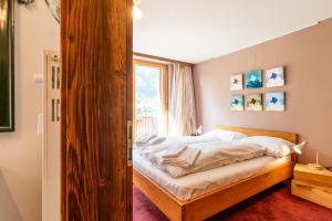 Postel nebo postele na pokoji v ubytování Duplex de charme à Zermatt