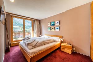 Postel nebo postele na pokoji v ubytování Duplex de charme à Zermatt