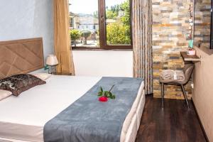 Postel nebo postele na pokoji v ubytování Enika Hotel