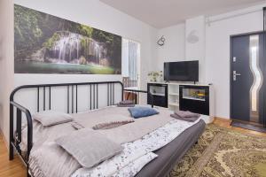 Katil atau katil-katil dalam bilik di Cutie apartment
