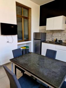 Kuchyňa alebo kuchynka v ubytovaní Casa della Lettera