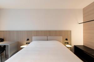 Ένα ή περισσότερα κρεβάτια σε δωμάτιο στο Parkhotel Izegem