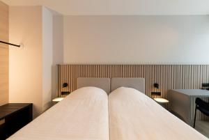 Ένα ή περισσότερα κρεβάτια σε δωμάτιο στο Parkhotel Izegem