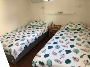 Postel nebo postele na pokoji v ubytování Studio Bloemenboerderij-Aperloo