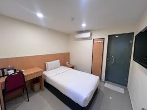 Postel nebo postele na pokoji v ubytování South of The Clouds HOTEL KL Sentral 吉隆坡彩云之南酒店-中央车站店