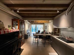 a kitchen with a table and some chairs in it at BS b&b斑光燦爛 月租 in Hsinchu City