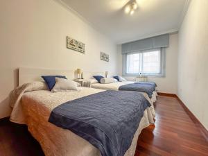 Łóżko lub łóżka w pokoju w obiekcie Apartamento completo, amplio, muy iluminado y con plaza de garaje incluida.