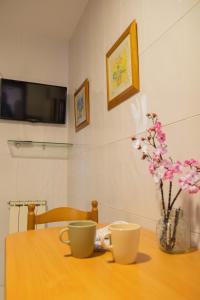 Telewizja i/lub zestaw kina domowego w obiekcie Apartamento completo, amplio, muy iluminado y con plaza de garaje incluida.