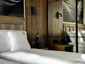 Łóżko lub łóżka w pokoju w obiekcie Apartamenty A&M Premium