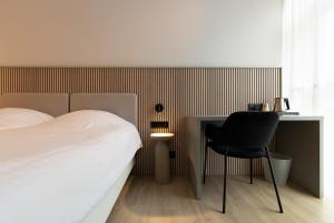 Ένα ή περισσότερα κρεβάτια σε δωμάτιο στο Parkhotel Izegem