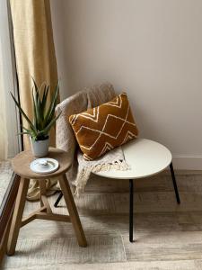 a living room with a chair and a table at Jalon townhouse in Jalón