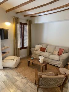 a living room with a couch and a table at Jalon townhouse in Jalón