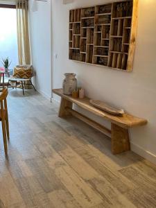 a living room with a wooden bench on the wall at Jalon townhouse in Jalón