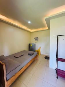 Postel nebo postele na pokoji v ubytování Cris & Mar Homestay