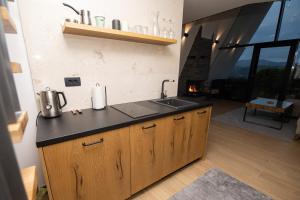 a kitchen with a sink and a counter top at Vila Hill Rest in Visoko
