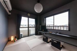 Rúm í herbergi á おやど紀伊国屋玉園町