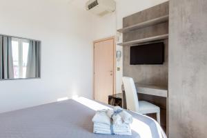 Letto o letti in una camera di ClubHotel Residence Cesenatico
