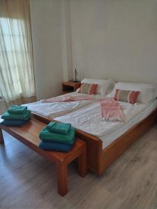 a large bed with two green pillows on it at Casa Betania ocean view in La Orotava