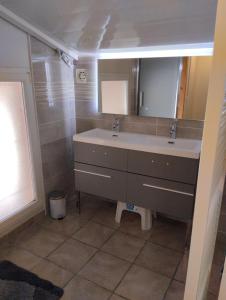 a bathroom with a sink and a mirror at La Maison de l'Ormeau in Montauban +21 photos