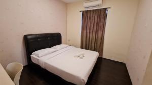 Postel nebo postele na pokoji v ubytování Jade Guesthouse Jonker Melaka