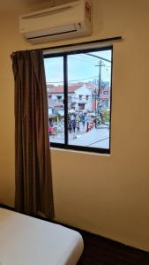 Postel nebo postele na pokoji v ubytování Jade Guesthouse Jonker Melaka