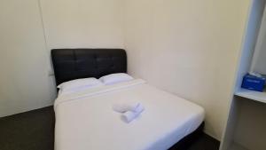 Postel nebo postele na pokoji v ubytování Jade Guesthouse Jonker Melaka
