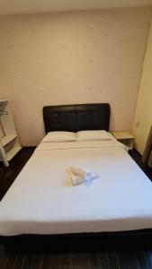 Postel nebo postele na pokoji v ubytování Jade Guesthouse Jonker Melaka