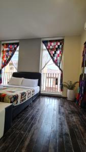 Postel nebo postele na pokoji v ubytování Jade Guesthouse Jonker Melaka