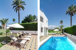 a villa with a swimming pool and palm trees at GRR - Elegant Villa with Exclusive Private Pool in Marbella