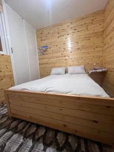 Postel nebo postele na pokoji v ubytování Tikida house