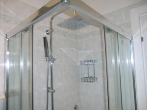Ванная комната в Residence Villaggio dei Fiori con Piscina e Posto Spiaggia Incluso