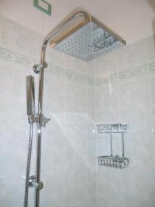 Ванная комната в Residence Villaggio dei Fiori con Piscina e Posto Spiaggia Incluso