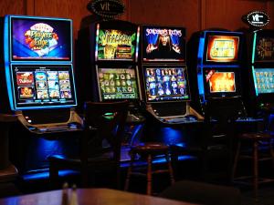 a row of slot machines in a casino at The Ritz Cafe and Motor Inn in Whitecourt