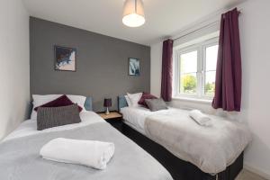 Voodi või voodid majutusasutuse Bright 4 Bedroom House-Sleeps 7-Parking-Nr Hospital-Ideal for Work Crews toas