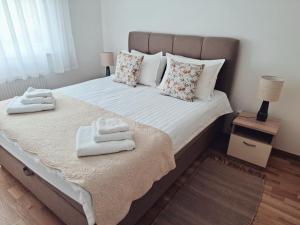 Postel nebo postele na pokoji v ubytování Apartman West Zen