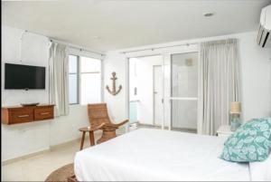 Ένα ή περισσότερα κρεβάτια σε δωμάτιο στο Hotel Ola de Mar