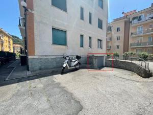 a scooter sitting on the side of a building at Alma House in Finale Ligure