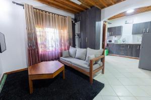 a living room with a couch and a table at Almasi in Ukunda +16 photos