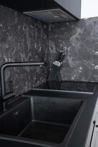 Kuchyňa alebo kuchynka v ubytovaní Navis city apartments