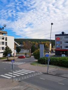 an empty street with a crosswalk in a city at City Apartment Hilla in Rovaniemi