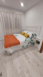 En eller flere senge i et værelse på AGRO da FONTE- Apartamento