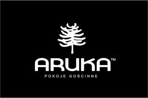 a logo with a pine tree on a black background at Aruka - Apartamenty Bardzo Blisko Plaży in Władysławowo
