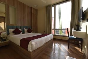 Hotel Anju Shree Inn-Near Jaipur Airport Terminal 1客房内的一张或多张床位