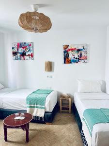 Кровать или кровати в номере RIAD OASIS D'ASILAH