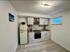 Kuchyň nebo kuchyňský kout v ubytování Ferienwohnung Hannah nahe Freiburg
