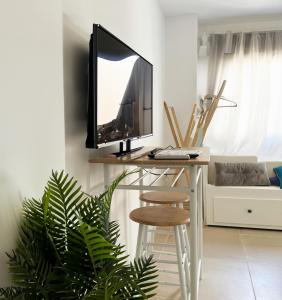a television sitting on a table in a living room at Costa by Hawkins Algeciras - Exterior 3B in Algeciras