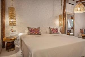 Postel nebo postele na pokoji v ubytování Mawimbi Boutique Hotel