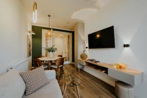 a living room with a couch and a table at Pool House in Tbilisi City
